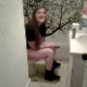 A guy records his girlfriend taking a shit in the bathroom. She has her hand between her legs and fails to explain why. No pooping sounds, but there are some audible farts.